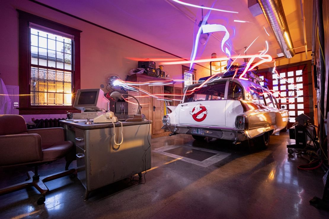 Ecto-1 is parked in the firehouse bay.